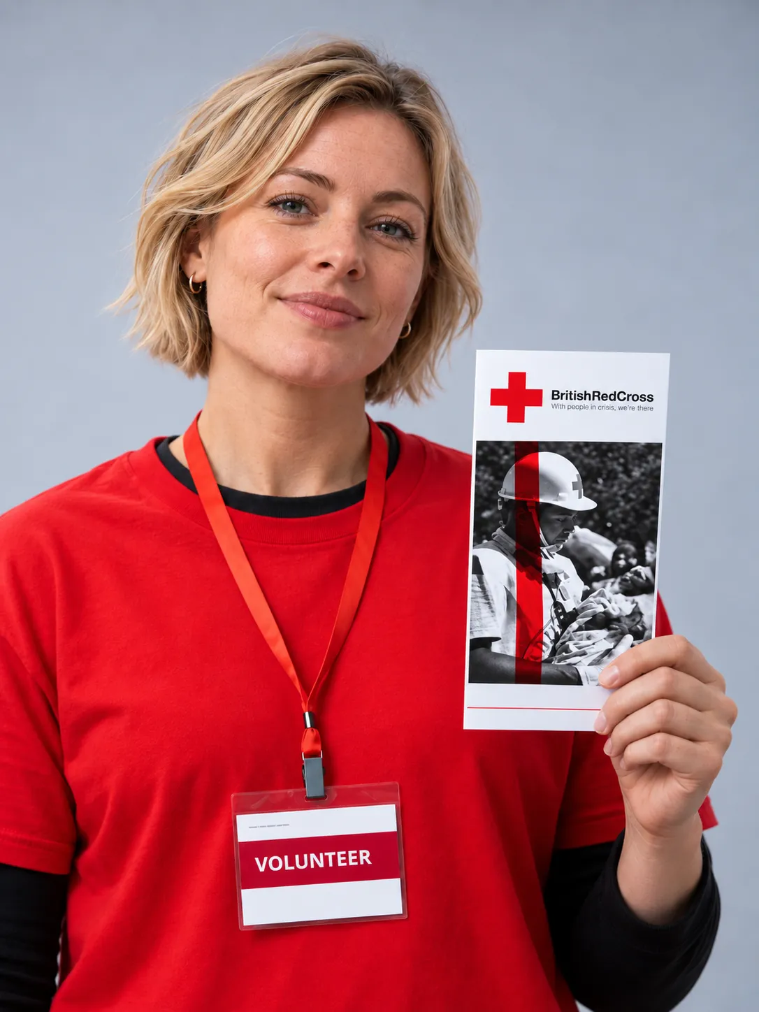 British Red Cross volunteer holding campaign collateral