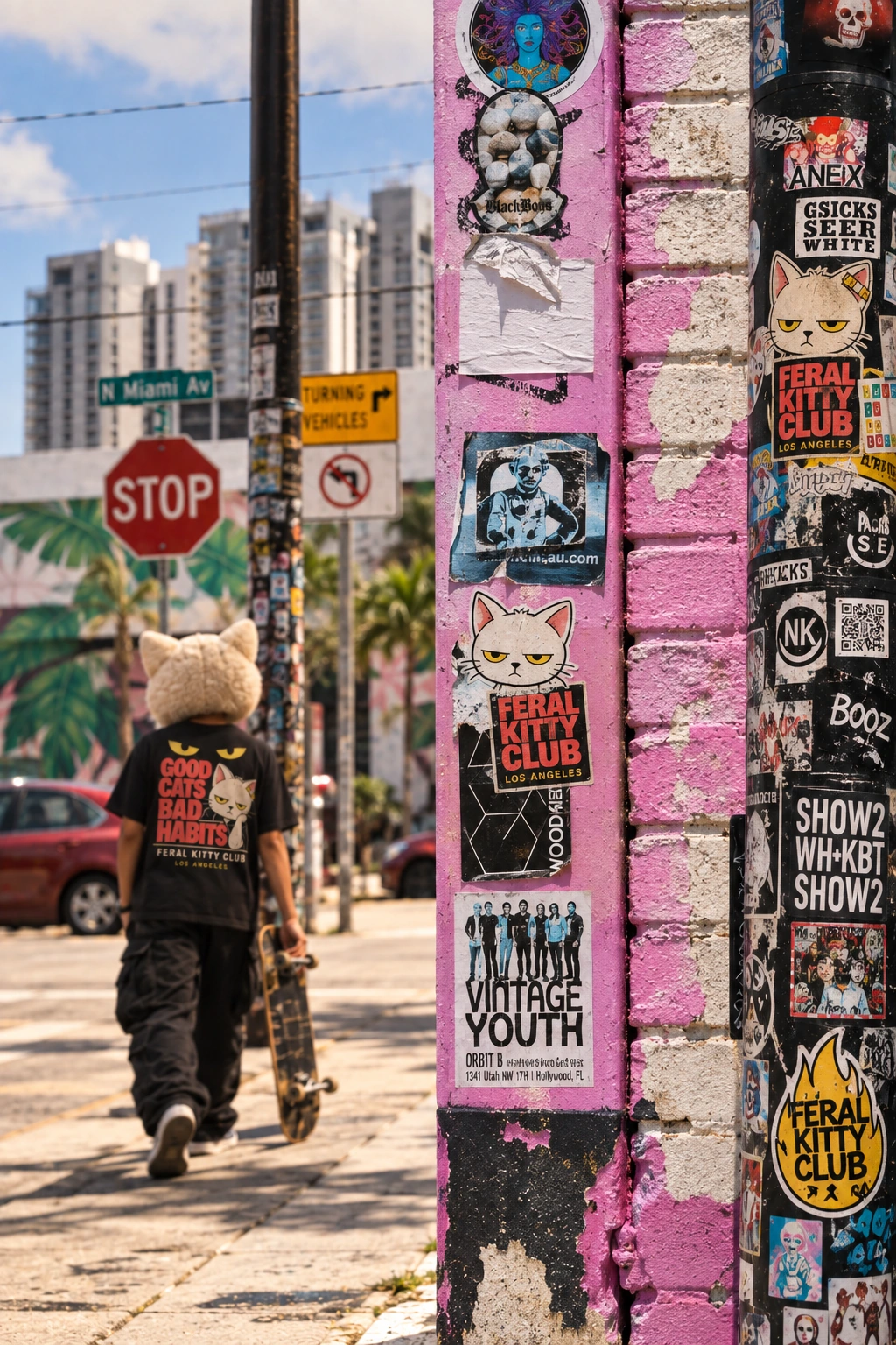 Feral Kitty Club stickers and apparel in a real street setting