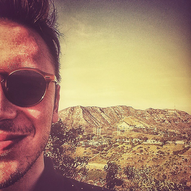 Jony Capecchi wearing sunglasses in a landscape